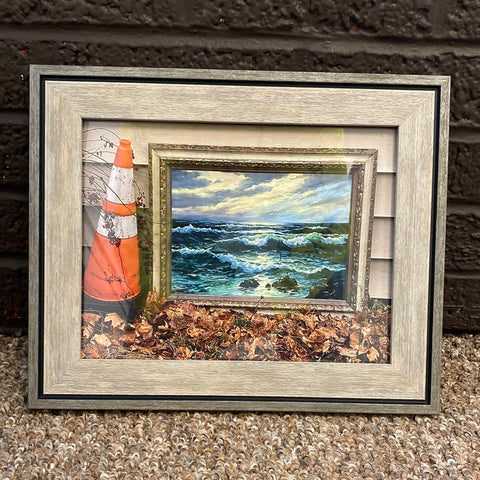 This is a framed print of a photo of a painting in the alley